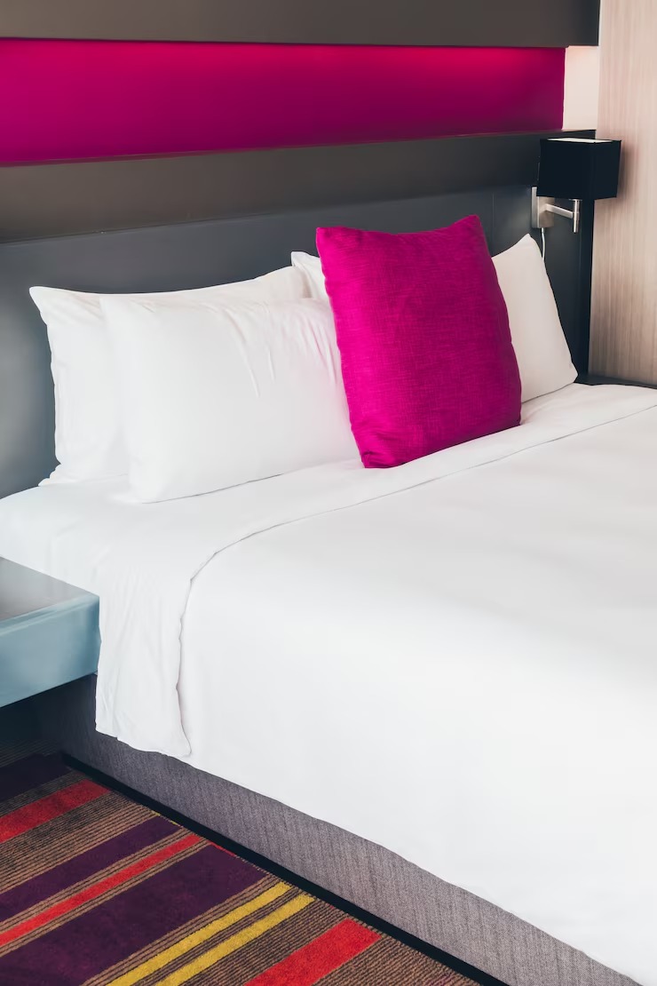 2 Bed White Sheets Pink Cushion by Orient Uniforms for customers in Dubai, Abu Dhabi, Sharjah, Ajman and across the UAE