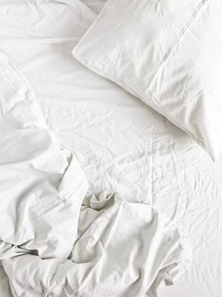 Flat Lay White Bed Pillows Blanket Sheet Top by Orient Uniforms for customers in Dubai, Abu Dhabi, Sharjah, Ajman and across the UAE